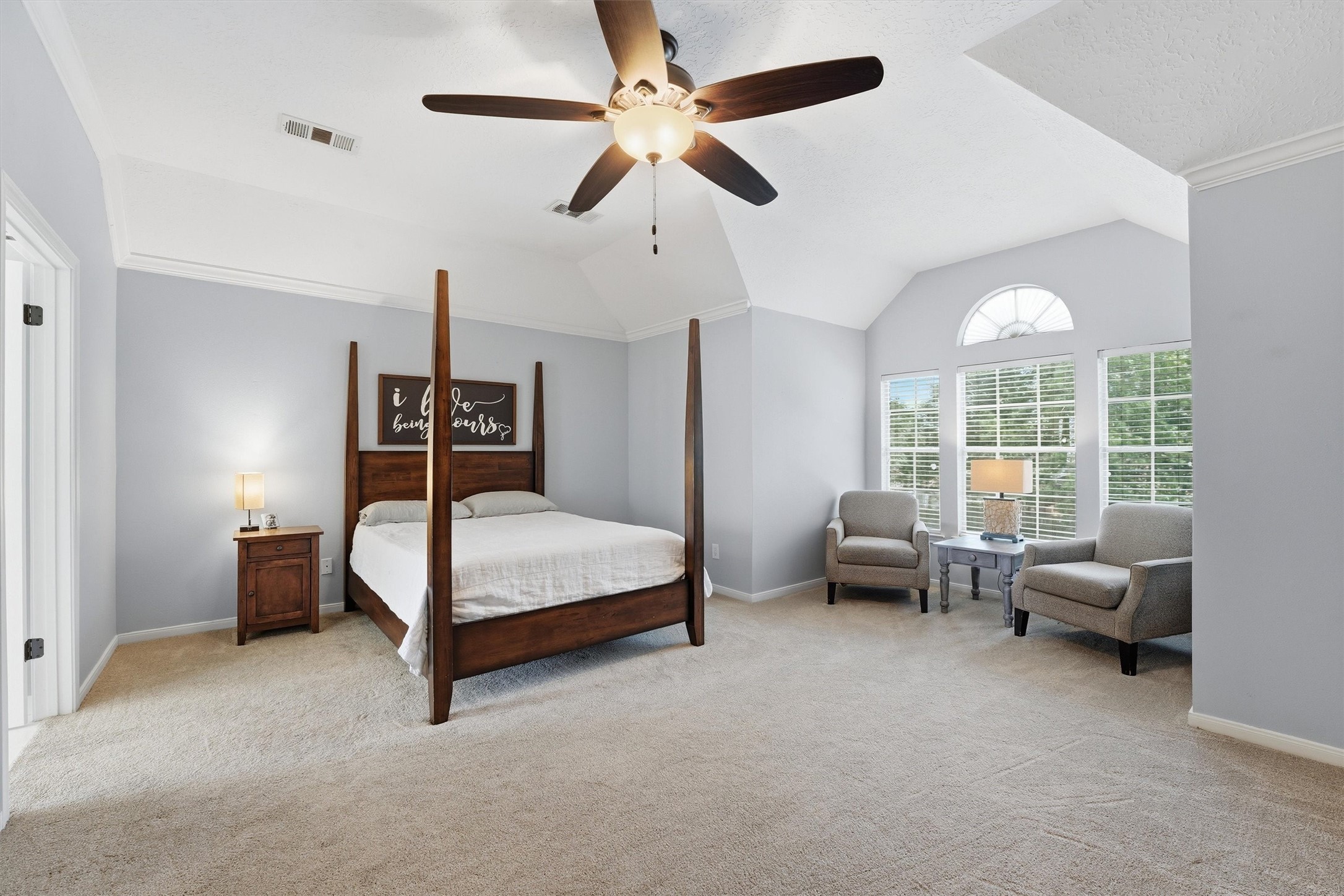 8827 Mile Run Road Humble, TX 77346 - Photo 18 of 37 a bedroom with a bed and a chandelier