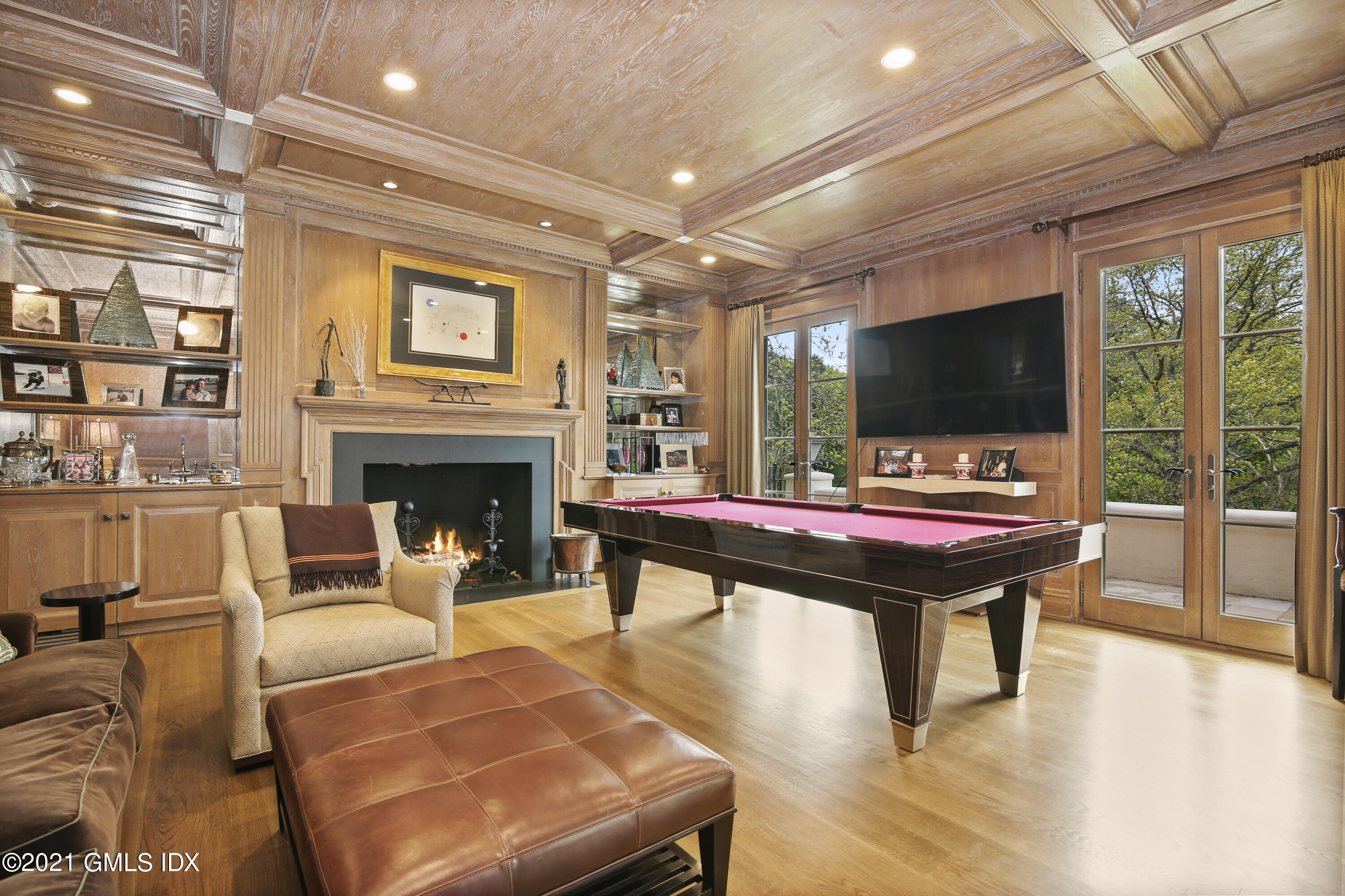 200 Stanwich Road Greenwich, CT 06830 - Photo 20 of 80 a living room with furniture a flat screen tv and a fireplace