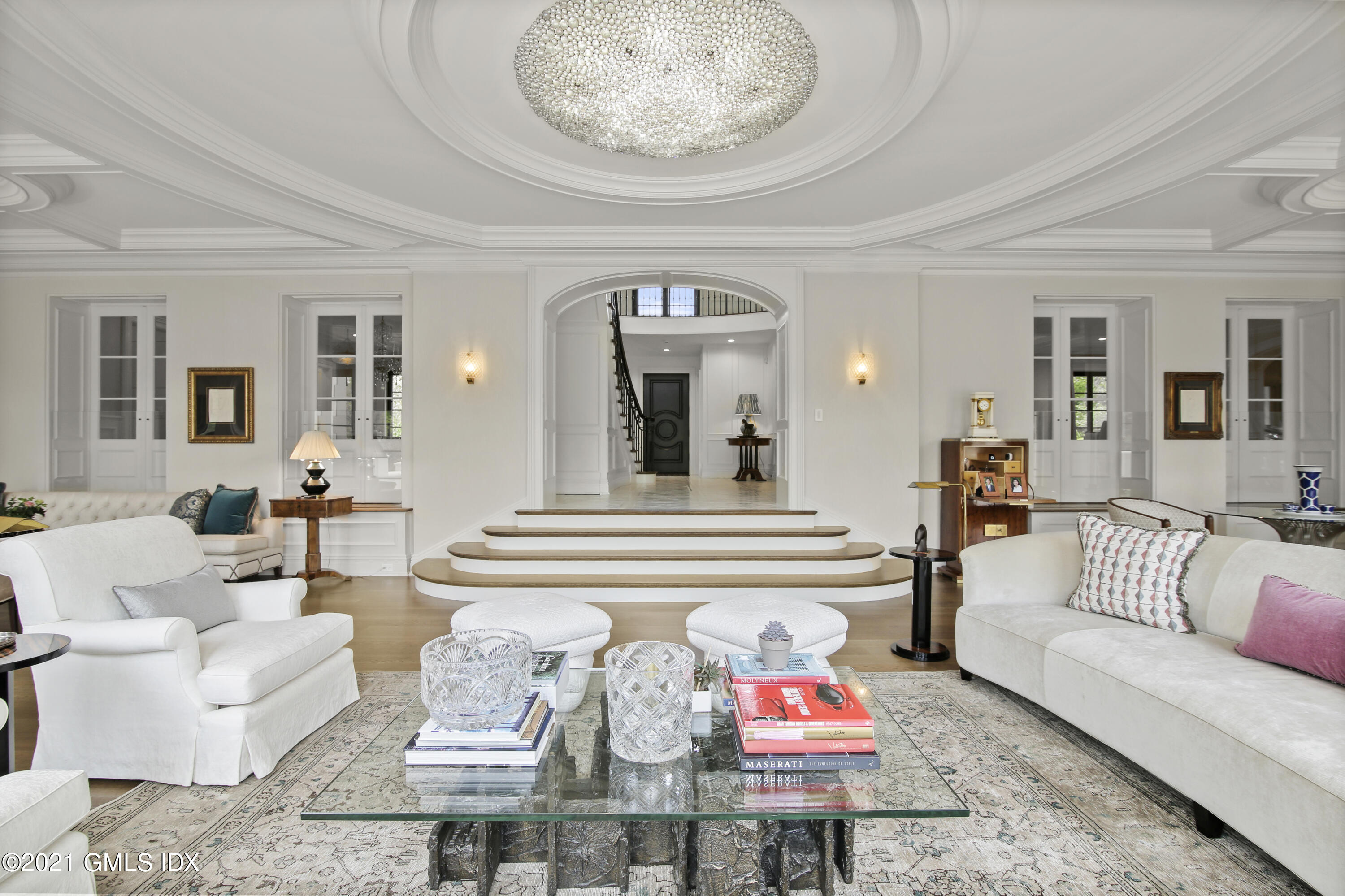 200 Stanwich Road Greenwich, CT 06830 - Photo 24 of 80 a living room with furniture and a chandelier