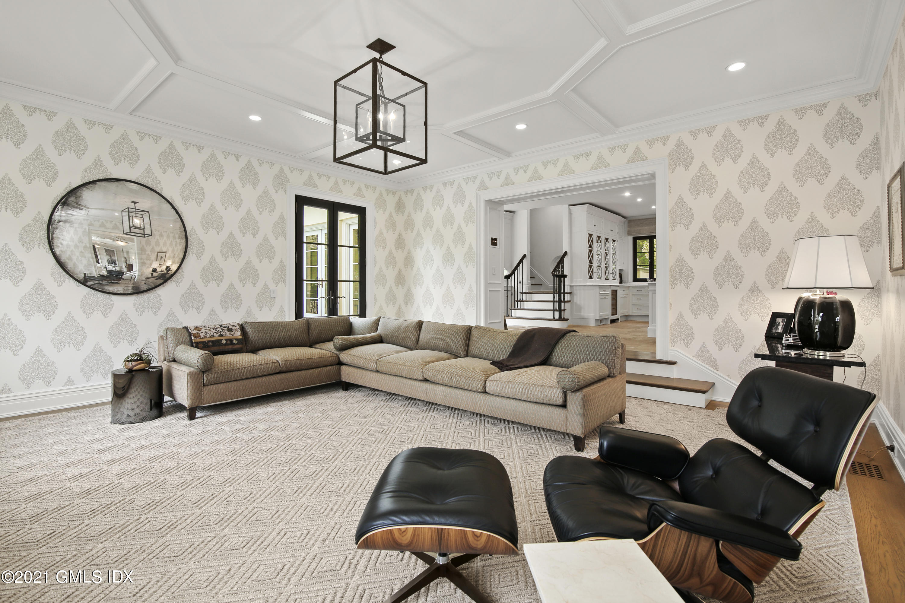 200 Stanwich Road Greenwich, CT 06830 - Photo 28 of 80 a living room with furniture a dining table and a chandelier