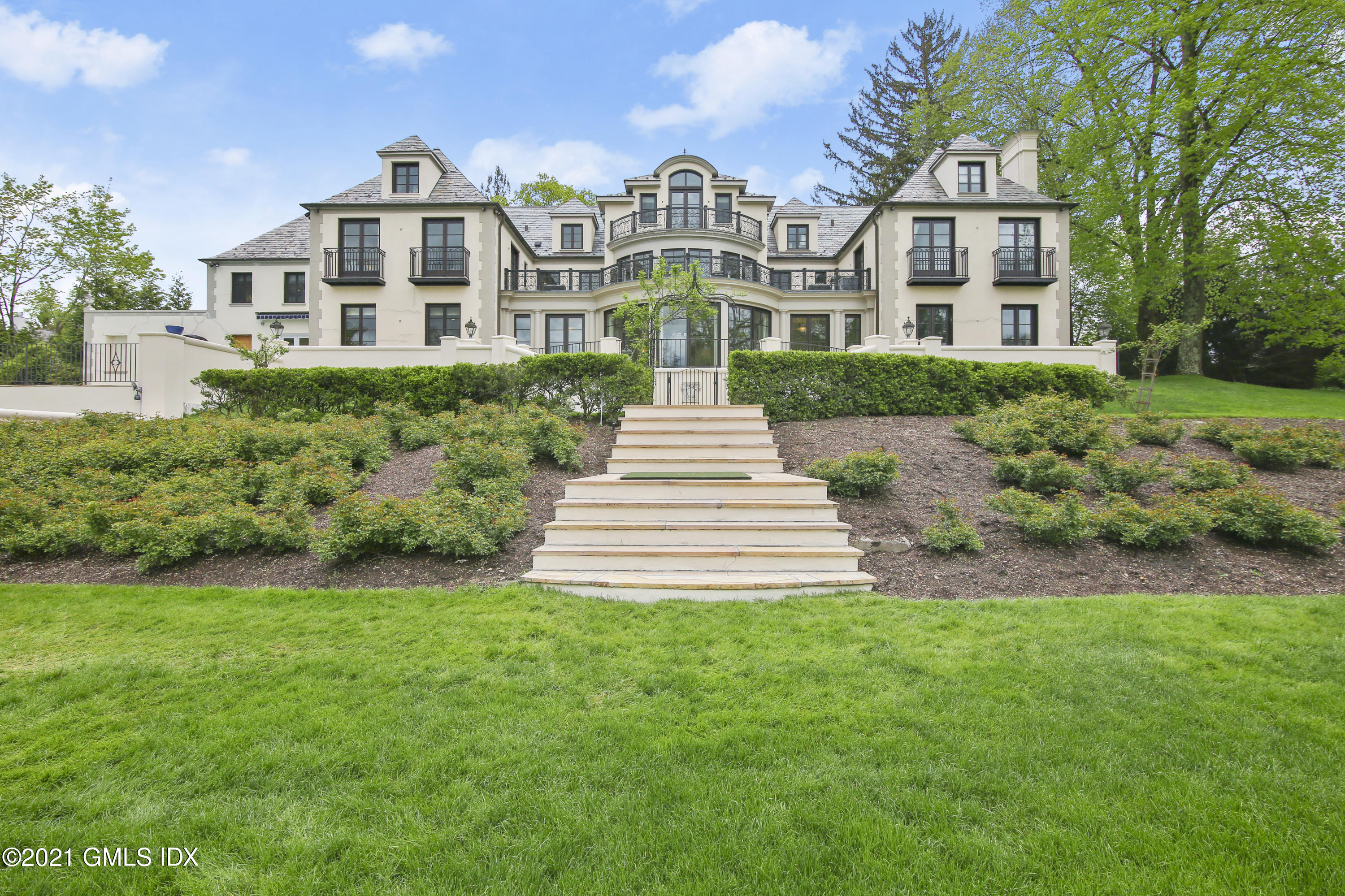 200 Stanwich Road Greenwich, CT 06830 - Photo 4 of 80 a front view of a house with a yard