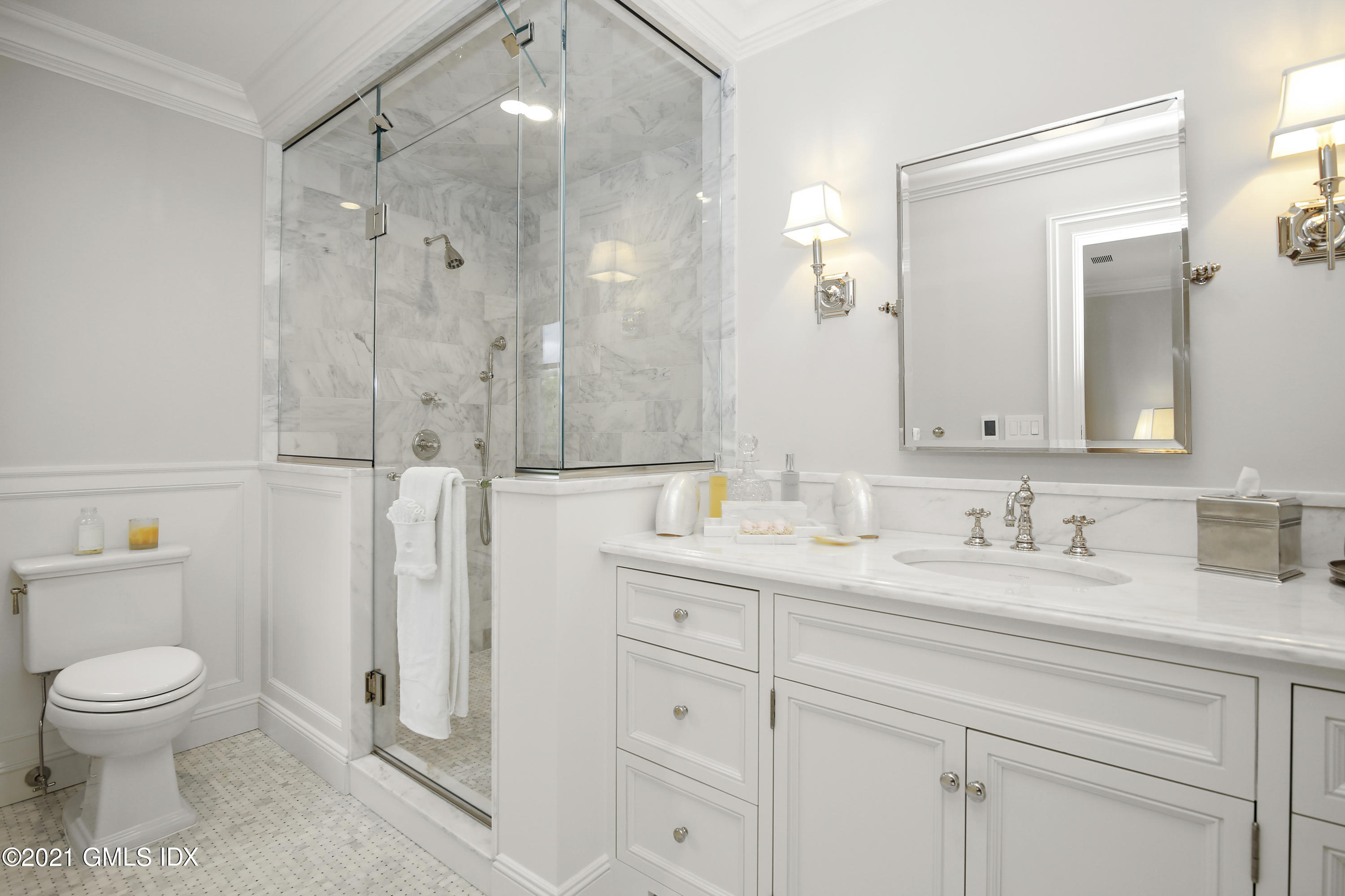 200 Stanwich Road Greenwich, CT 06830 - Photo 52 of 80 a bathroom with a granite countertop sink toilet a mirror a vanity and shower