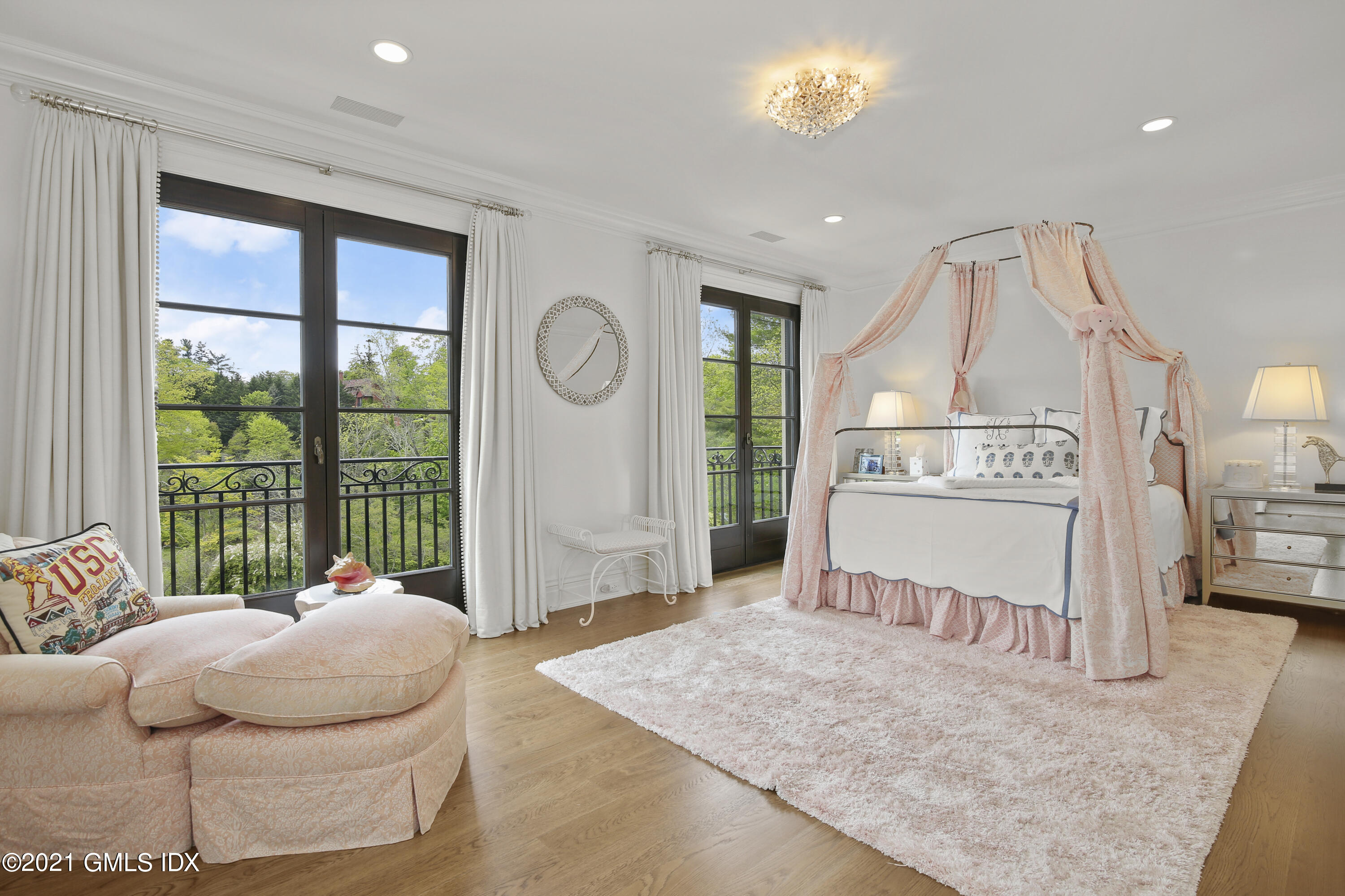 200 Stanwich Road Greenwich, CT 06830 - Photo 53 of 80 a spacious bedroom with a bed and a large window
