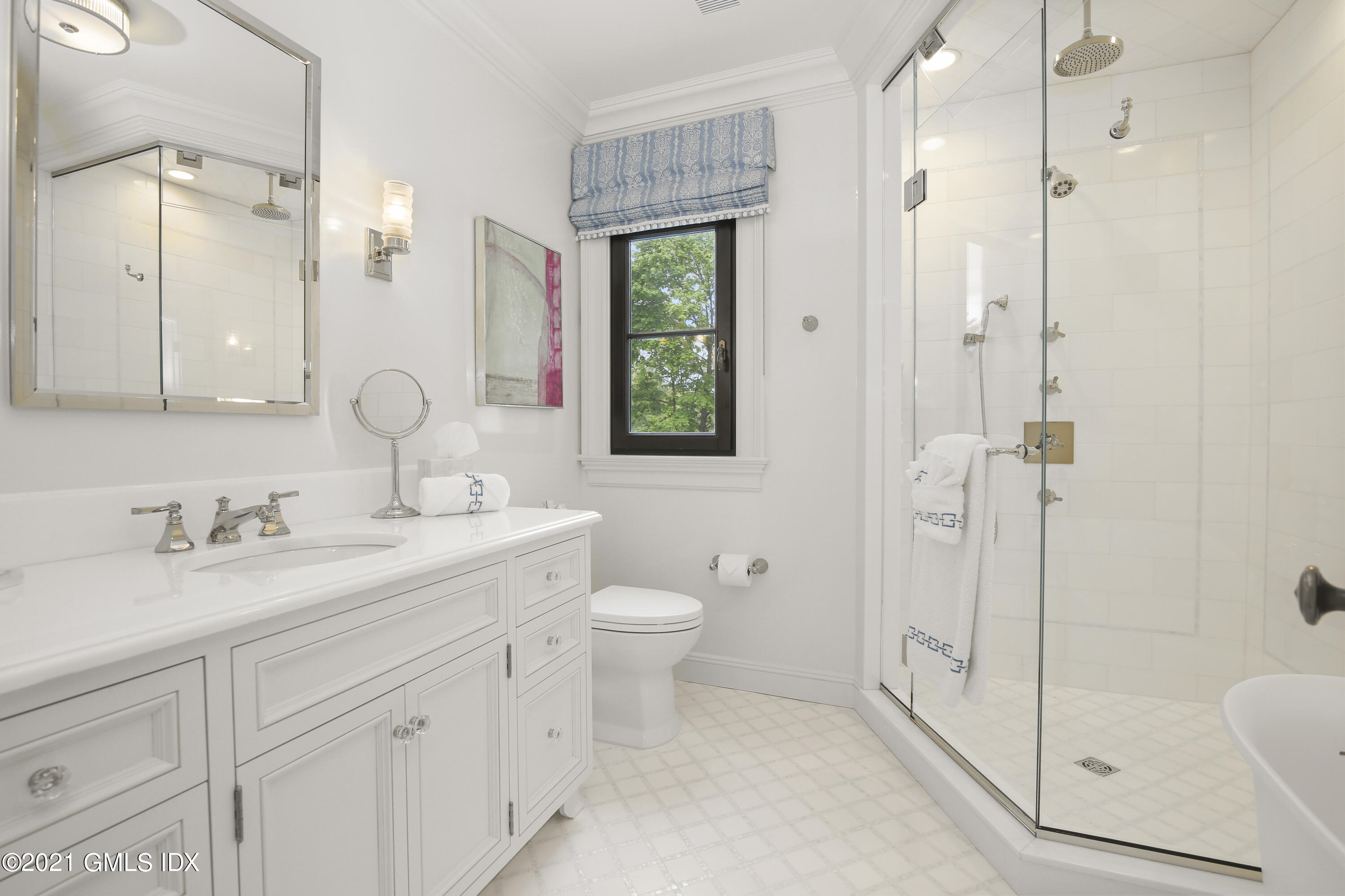 200 Stanwich Road Greenwich, CT 06830 - Photo 55 of 80 a bathroom with a toilet a sink a mirror a shower and vanity