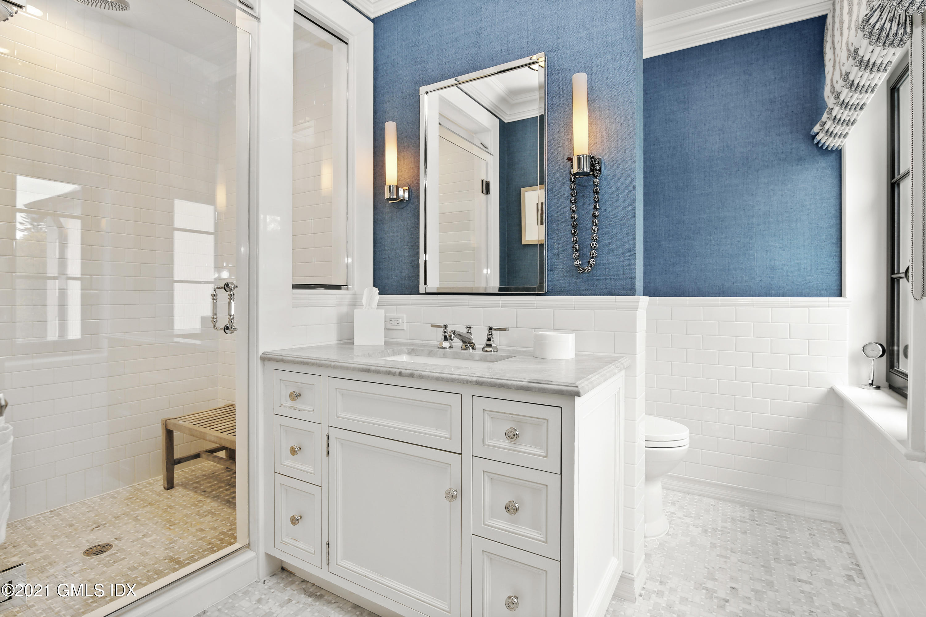 200 Stanwich Road Greenwich, CT 06830 - Photo 57 of 80 a bathroom with a granite countertop sink a mirror and a shower