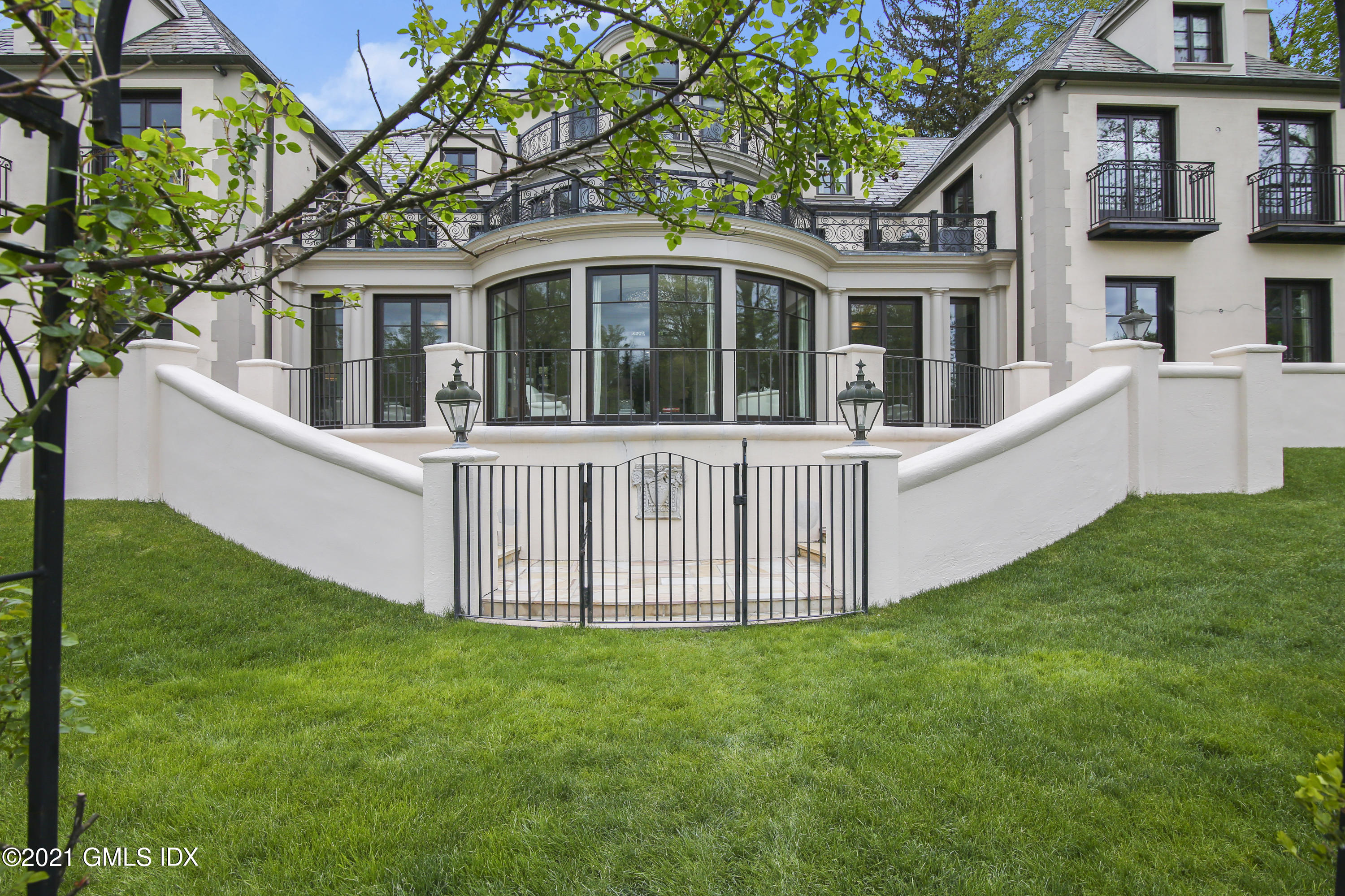 200 Stanwich Road Greenwich, CT 06830 - Photo 71 of 80 a view of a house with a yard and porch