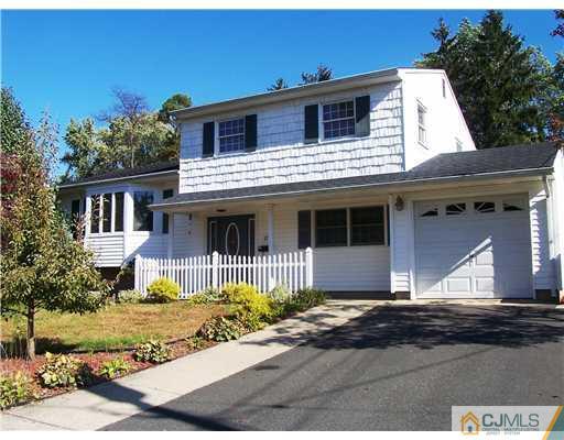 17 Hansen Road Old Bridge, NJ 08857 - Photo 1 of 21 a front view of a house with a yard