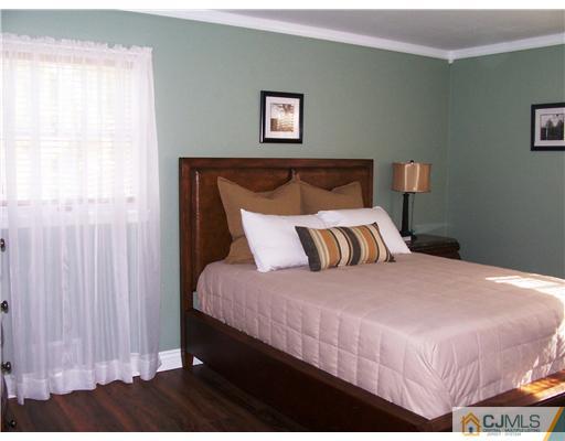 17 Hansen Road Old Bridge, NJ 08857 - Photo 11 of 21 a bedroom with a bed and a painting on the wall