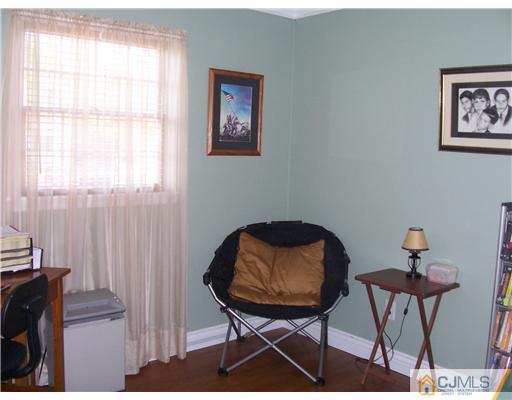 17 Hansen Road Old Bridge, NJ 08857 - Photo 13 of 21 a view of a workspace with furniture and a window
