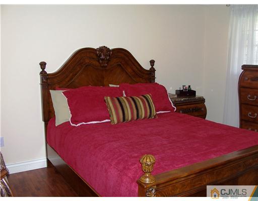 17 Hansen Road Old Bridge, NJ 08857 - Photo 15 of 21 a large bed sitting in a bedroom next to a window