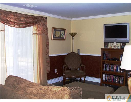 17 Hansen Road Old Bridge, NJ 08857 - Photo 16 of 21 a living room with furniture and a flat screen tv