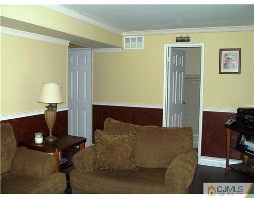 17 Hansen Road Old Bridge, NJ 08857 - Photo 17 of 21 a living room with furniture rug and a lamp