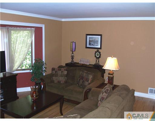17 Hansen Road Old Bridge, NJ 08857 - Photo 3 of 21 a living room with furniture a window and a lamp