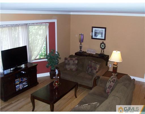 17 Hansen Road Old Bridge, NJ 08857 - Photo 5 of 21 a living room with furniture and a flat screen tv