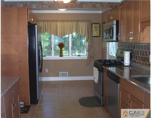17 Hansen Road Old Bridge, NJ 08857 - Photo 8 of 21 a kitchen with a sink and large window
