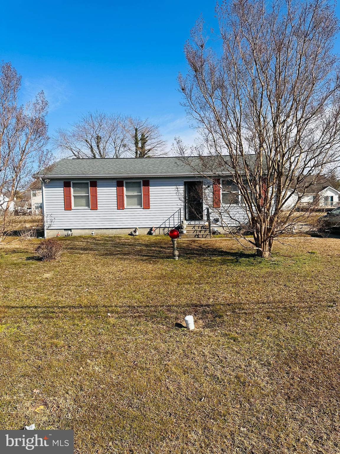 1114 Maces Lane Cambridge, MD 21613 - Photo 2 of 5 a front view of house with yard