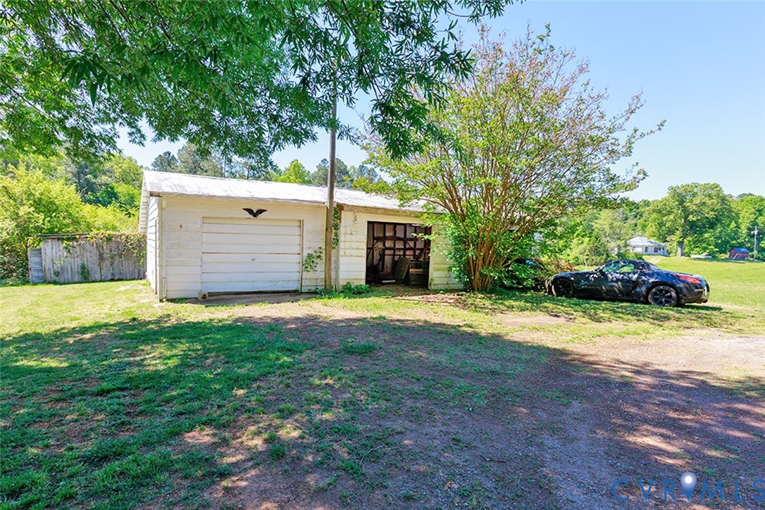 9903 Boze Road Ford, VA 23850 - Photo 28 of 45 a front view of a house with a yard and garage