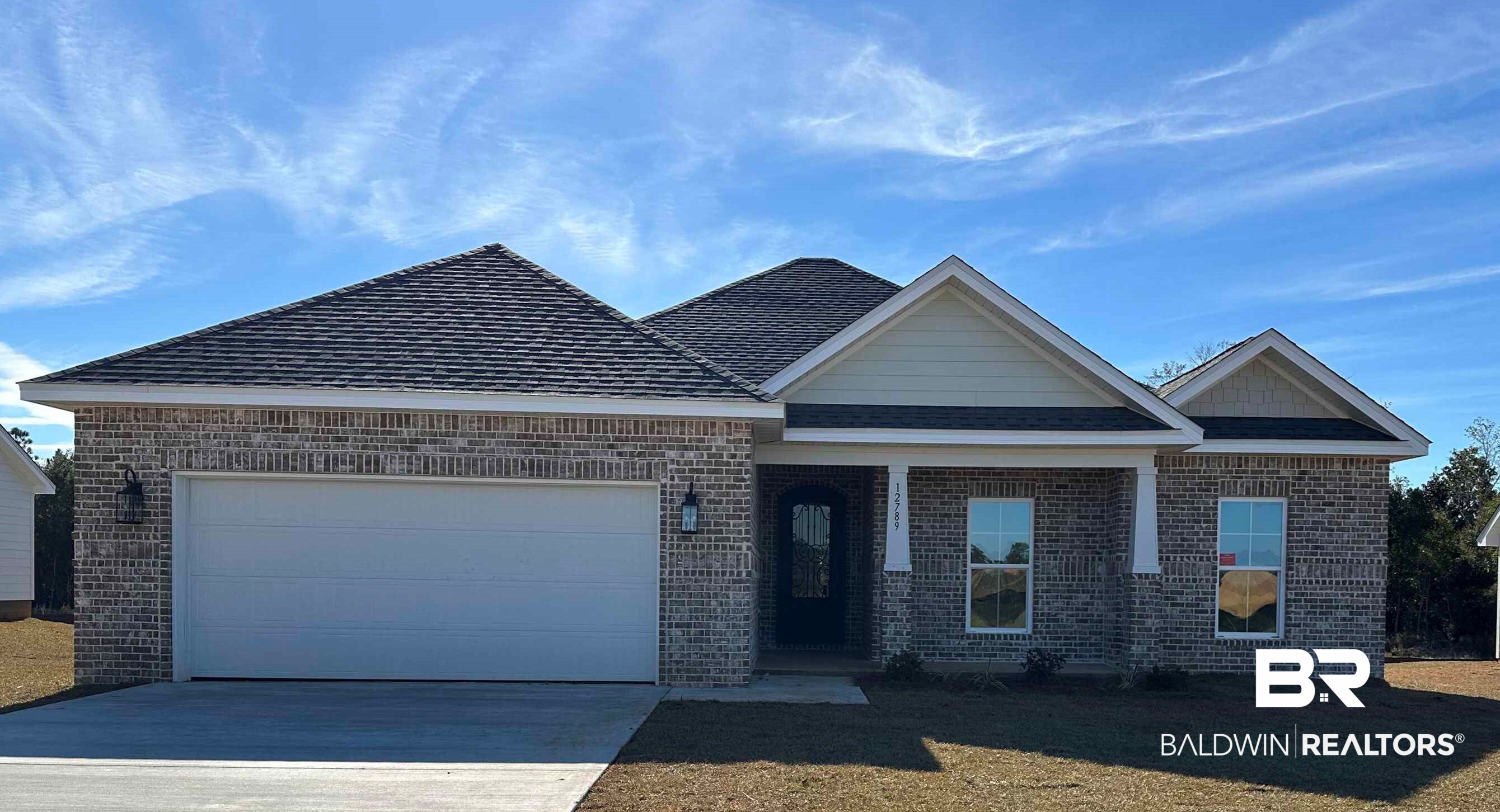 12766 Flanagan Street Elberta, AL 36530 - Photo 1 of 14 View of front of house with a garage and a front yard