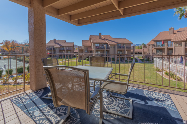 860 South Village Road, Unit Y8 St. George, UT 84770 - Photo 15 of 29 View of patio with outdoor dining area and a residential view