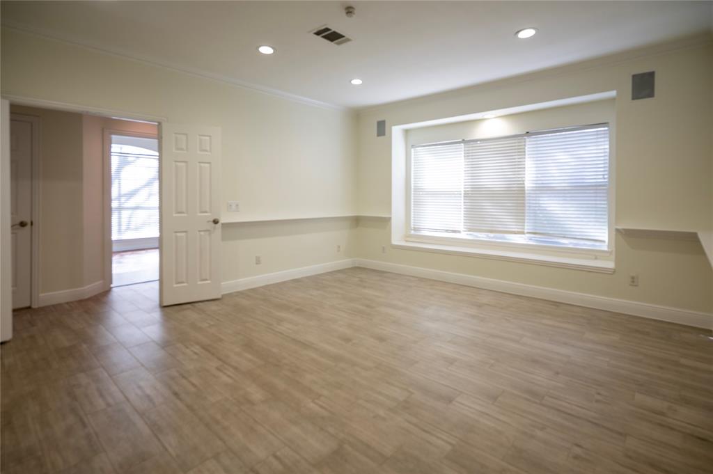 413 Ridge Meade Drive Lewisville, TX 75067 - Photo 18 of 37 Flex living room with french door opening and a built in gas fireplace. The can be great with playroom, office, gym, etc