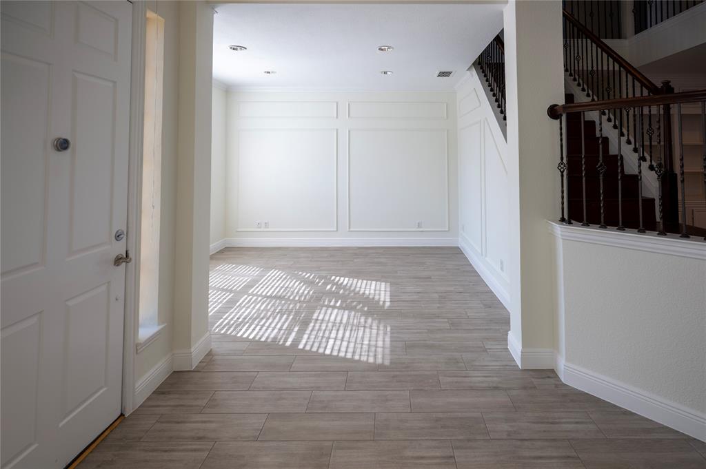 413 Ridge Meade Drive Lewisville, TX 75067 - Photo 2 of 37 Front living space, open off the entry