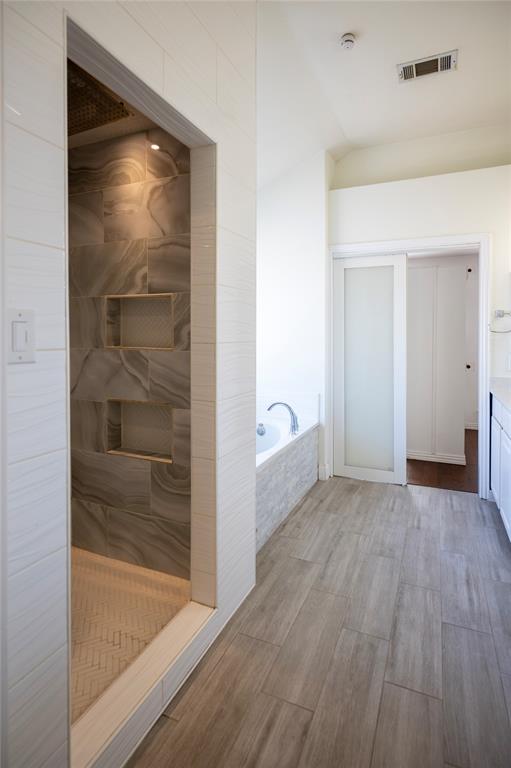 413 Ridge Meade Drive Lewisville, TX 75067 - Photo 21 of 37 Primary bathroom with building in updated shower, jetted tub and 2 sinks