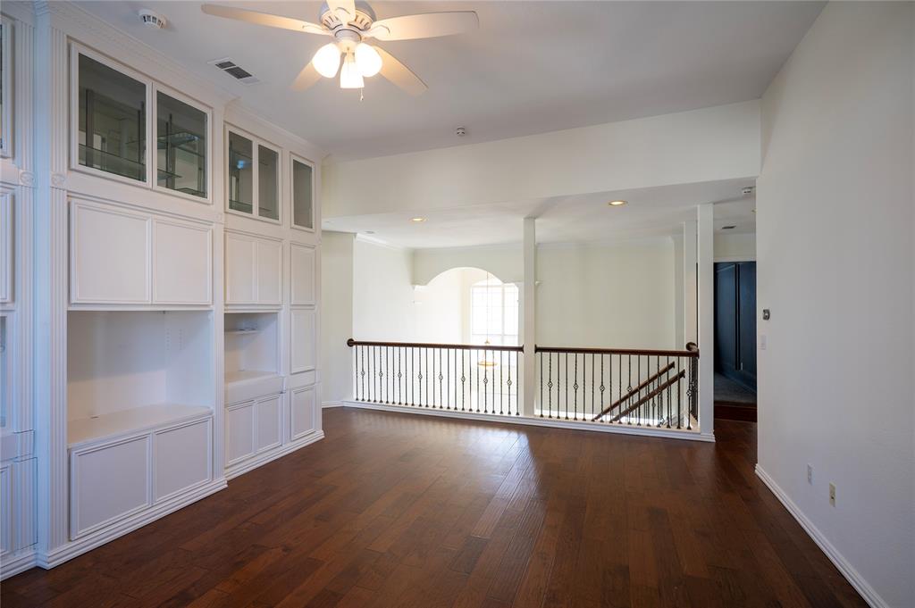 413 Ridge Meade Drive Lewisville, TX 75067 - Photo 23 of 37 2nd floor loft area with built-ins and door to 2nd floor balcony