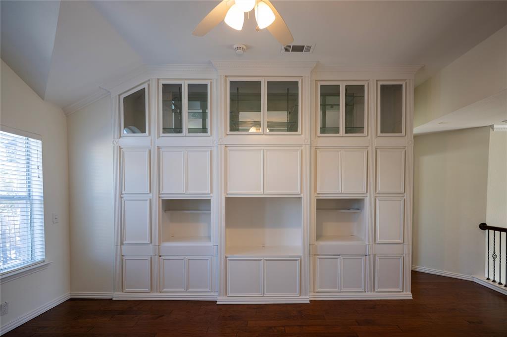 413 Ridge Meade Drive Lewisville, TX 75067 - Photo 24 of 37 2nd floor loft area with built-ins and door to 2nd floor balcony