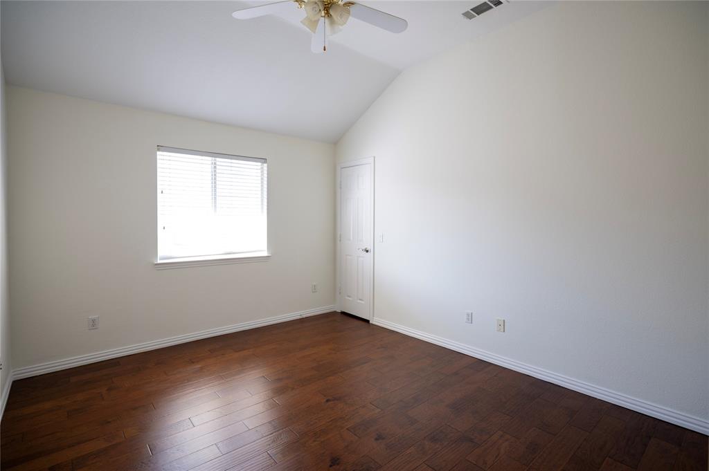 413 Ridge Meade Drive Lewisville, TX 75067 - Photo 27 of 37 2nd floor bedroom with wood floors and ceiling fan