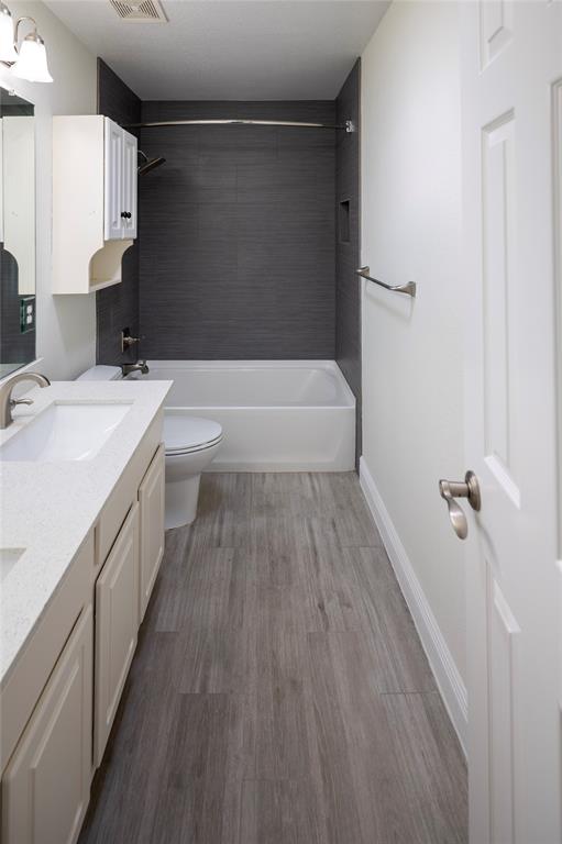 413 Ridge Meade Drive Lewisville, TX 75067 - Photo 30 of 37 2nd floor bathroom with double vanity, shower and tub