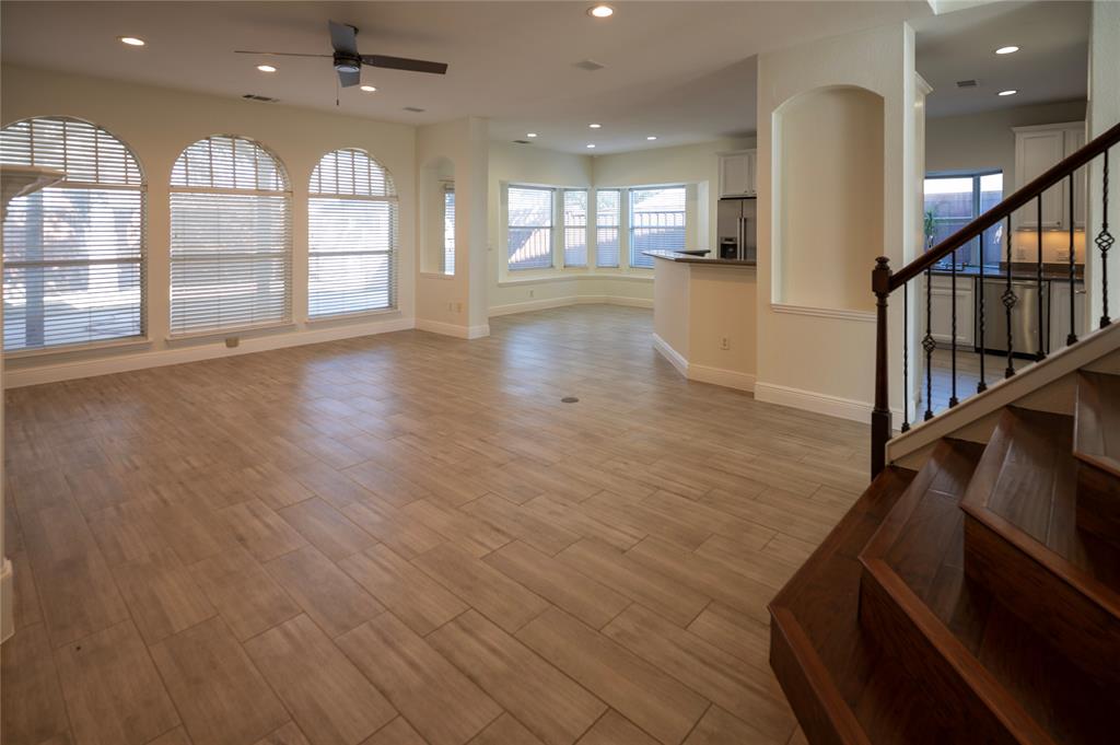 413 Ridge Meade Drive Lewisville, TX 75067 - Photo 9 of 37 Opening living space into the kitchen, dining area and stairs