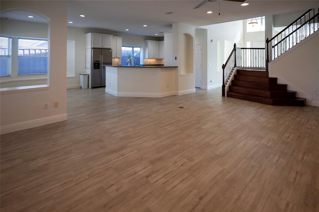 413 Ridge Meade Drive Lewisville, TX 75067 - Photo 10 of 37 Open living space into the kitchen, dining area and stairs