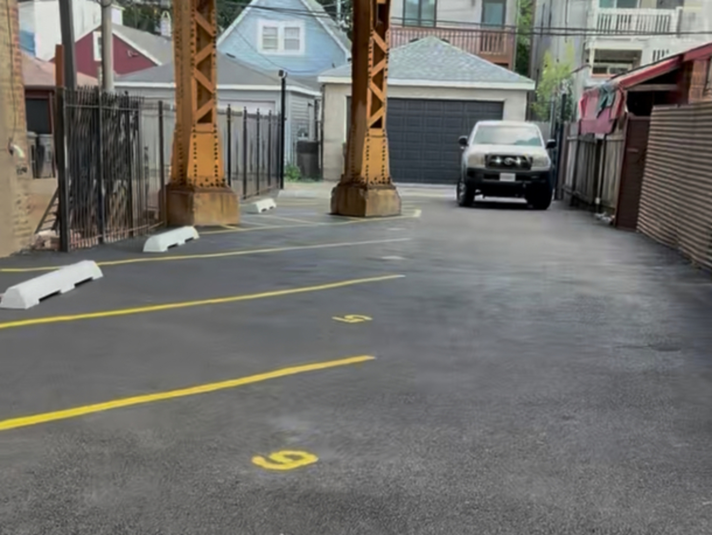 2443 West Armitage Avenue, Unit PARKING Chicago, IL 60647 - Photo 1 of 3 a view of a street with cars