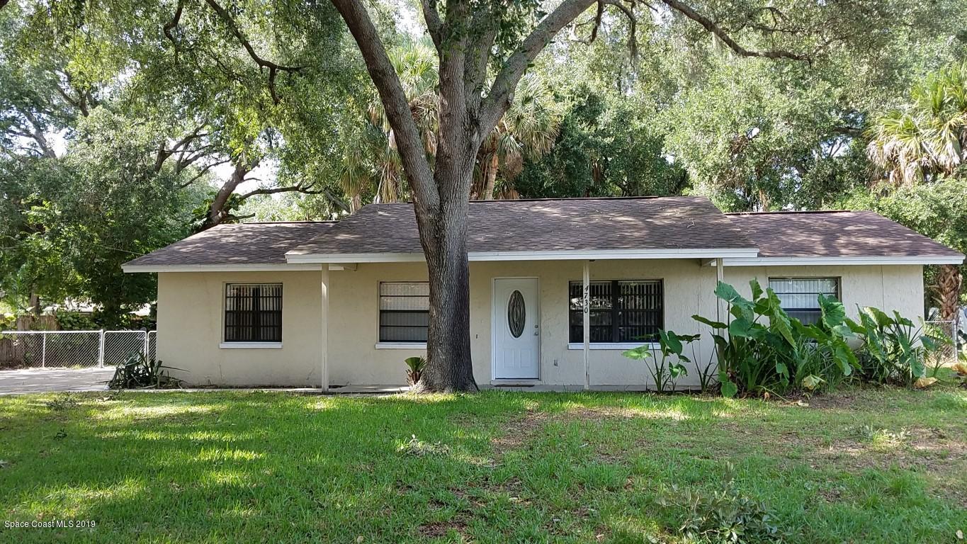 4730 Ivan Street Cocoa, FL 32927 - Photo 1 of 23 front view of house with a yard