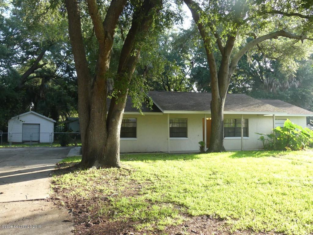 4730 Ivan Street Cocoa, FL 32927 - Photo 2 of 23 a view of a house with a yard