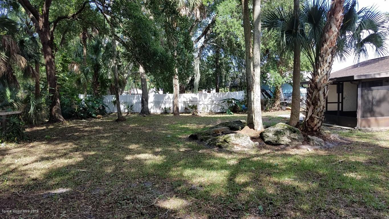 4730 Ivan Street Cocoa, FL 32927 - Photo 14 of 23 a view of a tree in front of a house