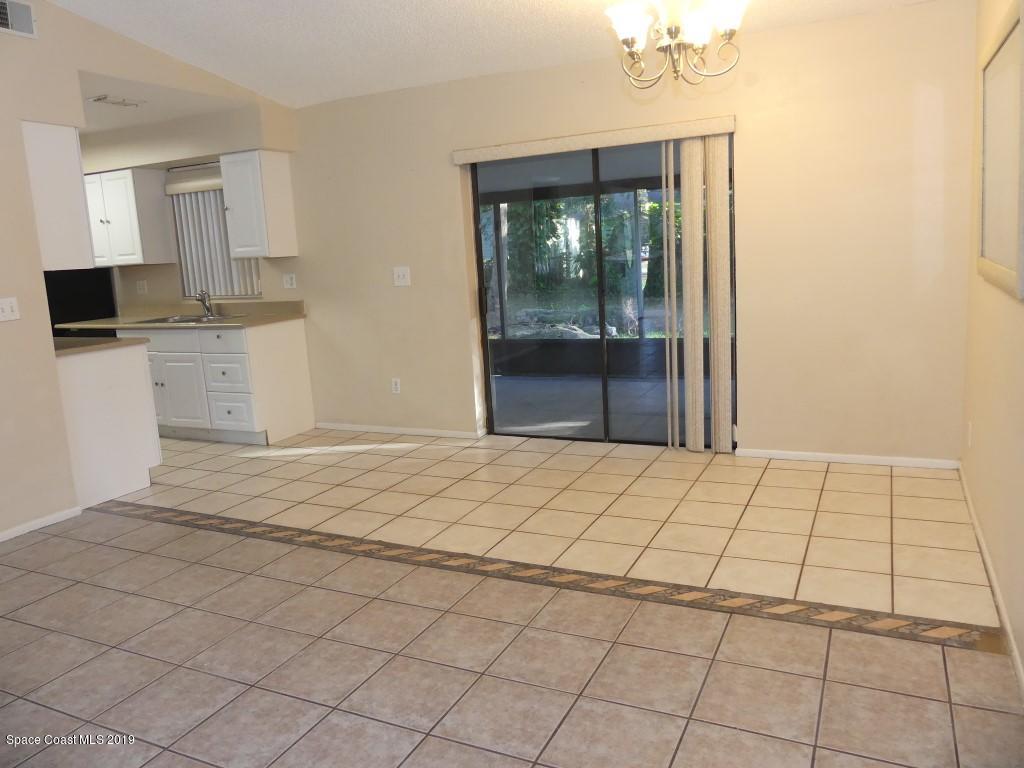 4730 Ivan Street Cocoa, FL 32927 - Photo 5 of 23 a room with a bed and a view of kitchen