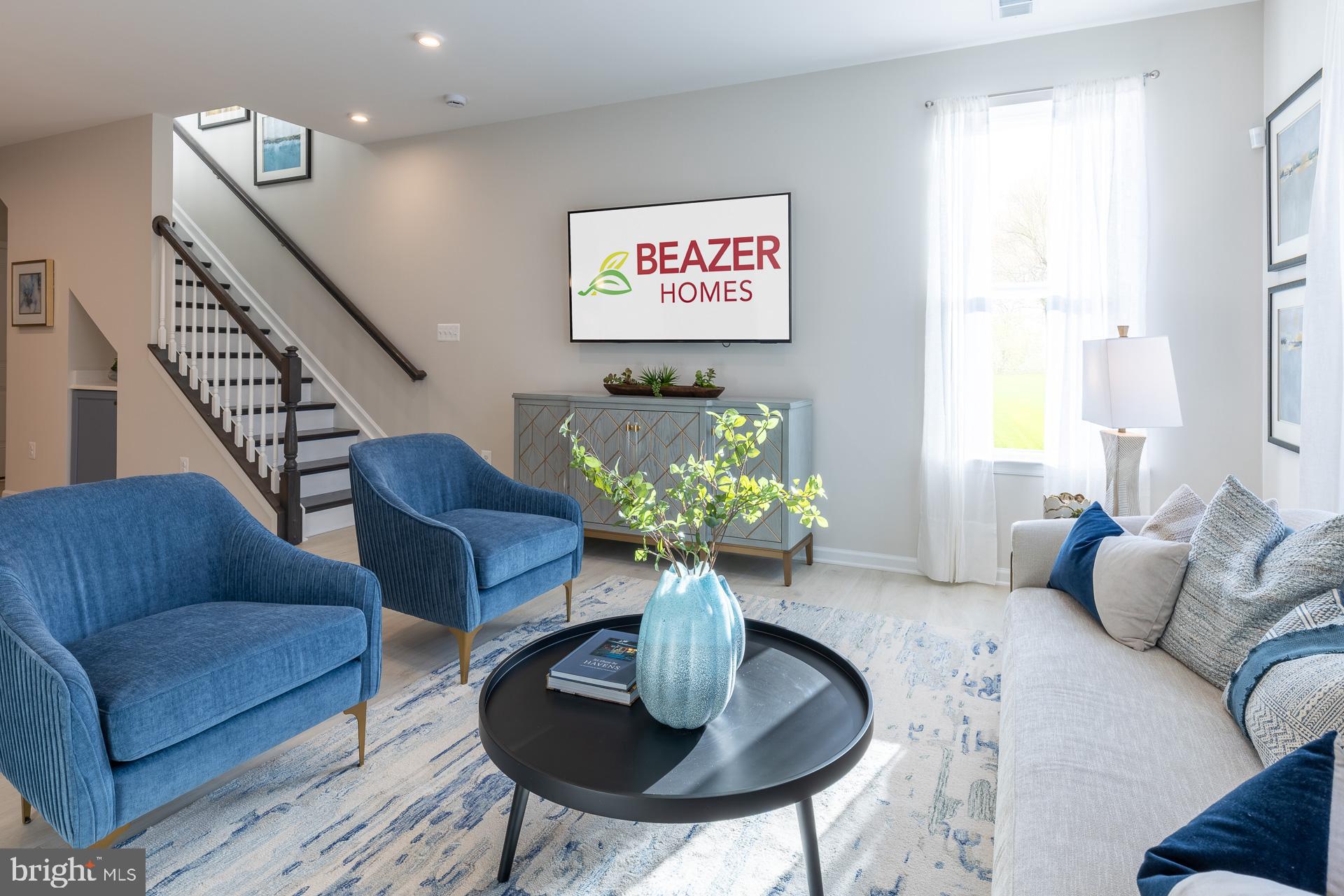 9982 A Justify Run Laurel, MD 20723 - Photo 4 of 11 a living room with furniture potted plant and a window