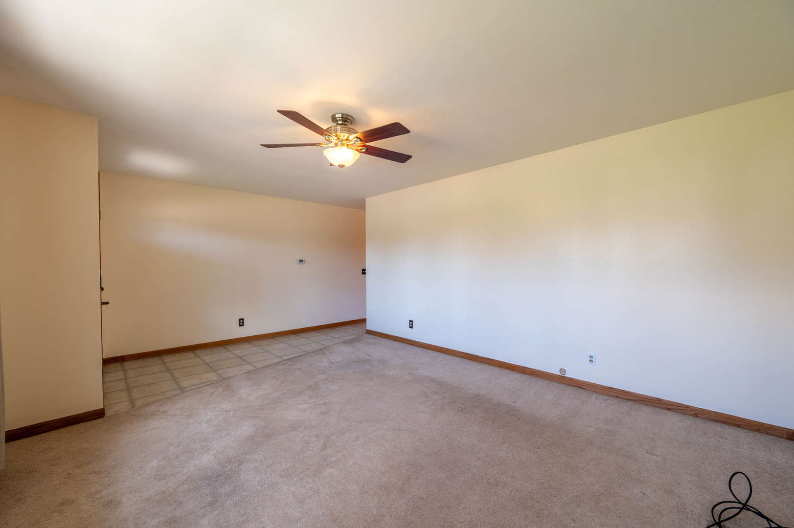 1018 Tee Street Dixon, IL 61021 - Photo 11 of 31 an empty room with a chandelier fan and a window