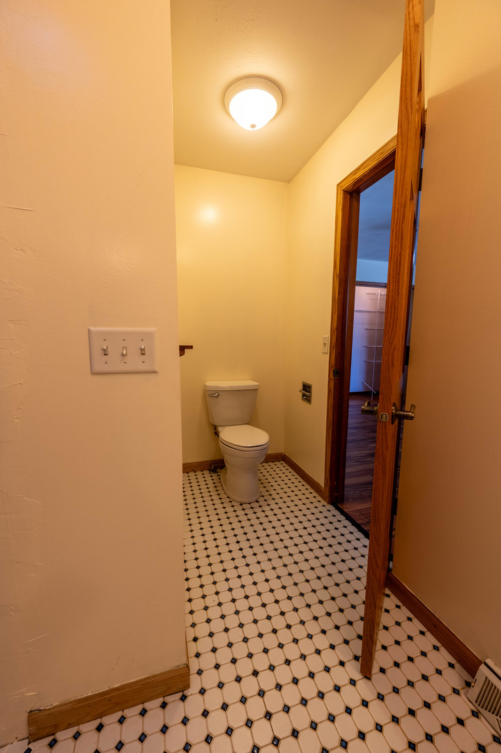 1018 Tee Street Dixon, IL 61021 - Photo 22 of 31 a bathroom with a sink and a toilet