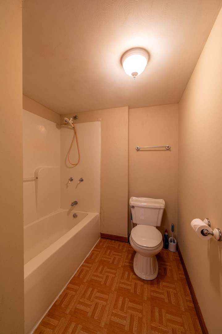 1018 Tee Street Dixon, IL 61021 - Photo 28 of 31 a bathroom with a toilet and a shower