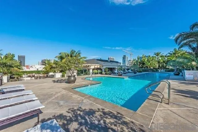 a view of a swimming pool with a lounge chairs