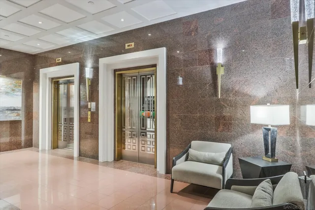 a living room with furniture and a lamp
