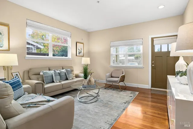 a living room with furniture and a window