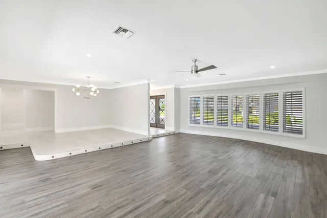 a large kitchen with kitchen island granite countertop a counter space and stainless steel appliances
