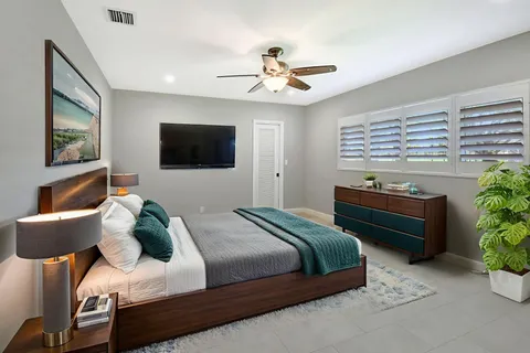 a living room with hardwood floor and a flat screen tv