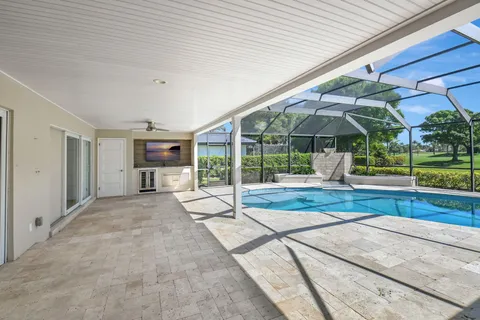 an aerial view of house with yard swimming pool and outdoor seating