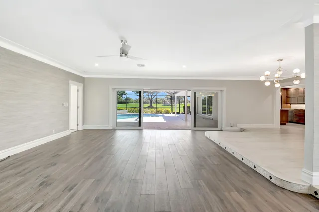 a large kitchen with kitchen island granite countertop a large window