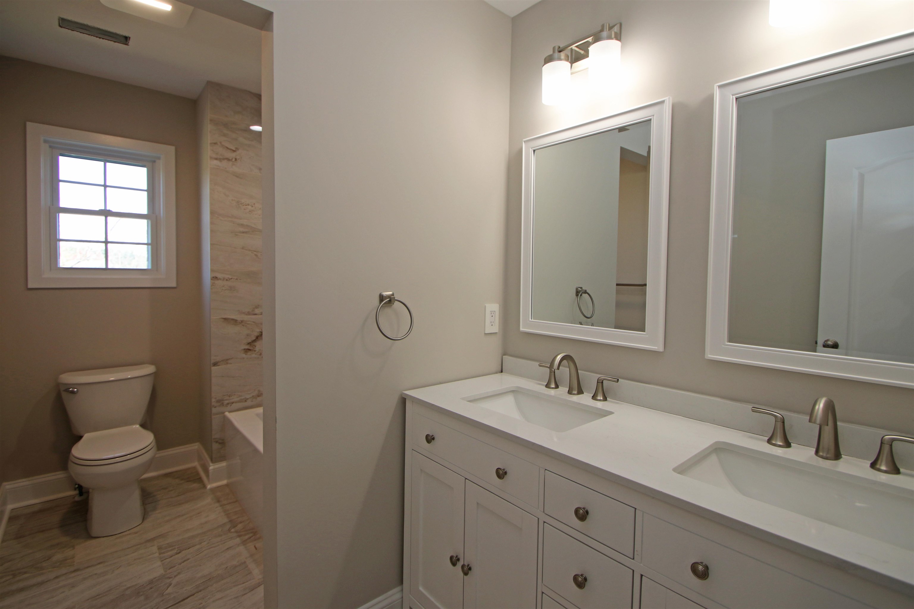 2060 Willow Hill Drive Harrisonburg, VA 22801 - Photo 27 of 43 a bathroom with a double vanity sink toilet and a mirror