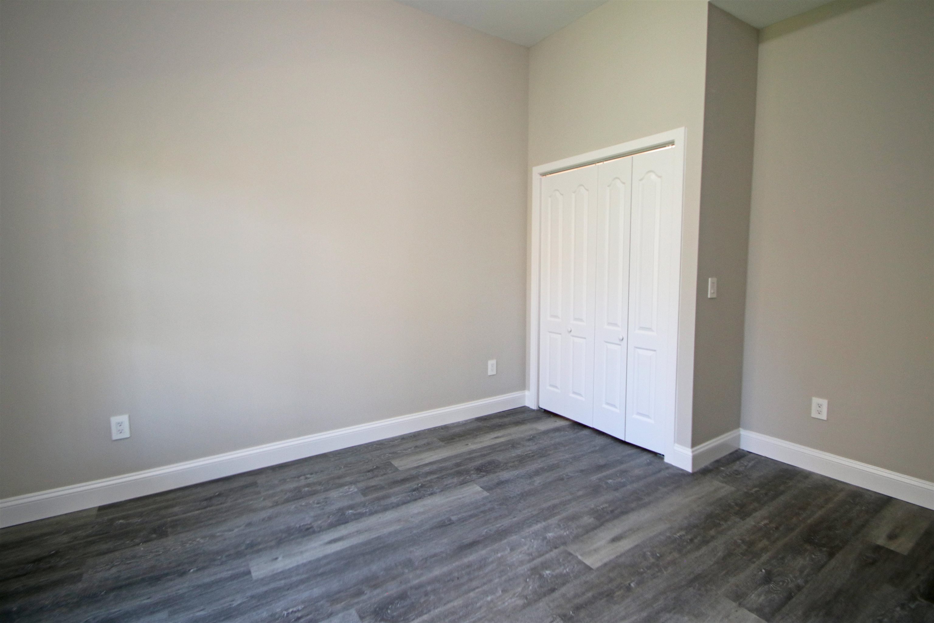 2060 Willow Hill Drive Harrisonburg, VA 22801 - Photo 37 of 43 a view of an empty room with wooden floor and closet